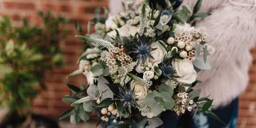 This is a picture of a Brides Wedding Flower Handtied Bouquet designed to match her outfit.