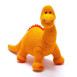 Best Years Orange Knitted Diplodocus Dinosaur Baby Rattle. Made From 100% acrylic yarn with recycled polyester stuffing in a vibrant orange knitted fur. Featuring deep orange felt claws and spikes along the back, with hand stitched eyes.