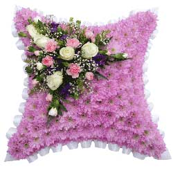 Funeral Flower Cushion Tributes are available in five sizes from 12 to 23 inches, they come in a variety of colours with flower placements, they can also have a name sash.