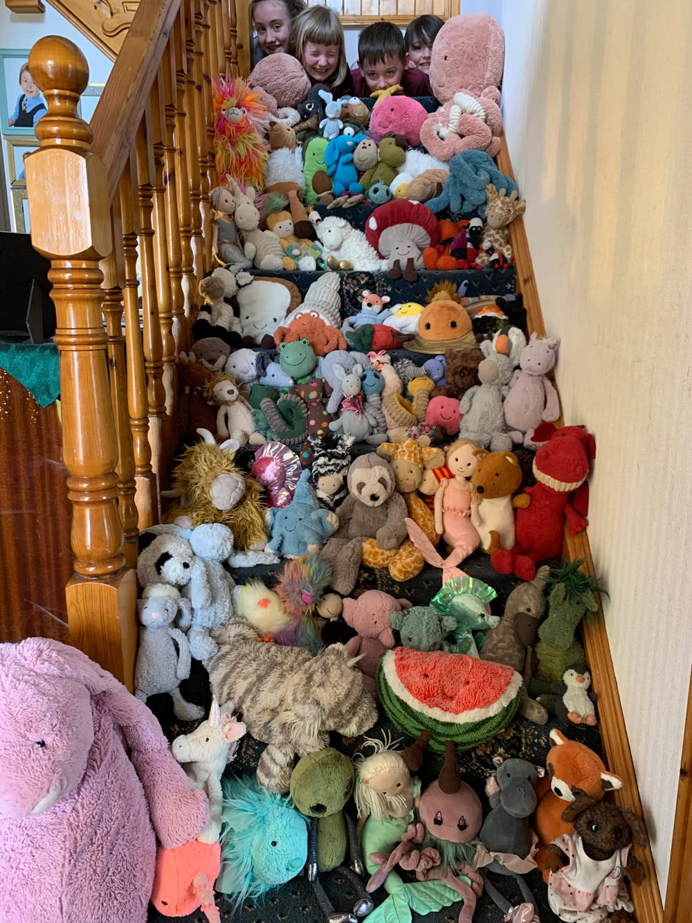 Jellycat soft toys filling a complete staircase