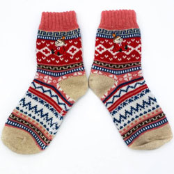 Moomin Fair Isle Little My Socks. Stay warm with these super stylish Little My Fair Isle socks. Coming with a fun vibrant pattern in tones of red, pink, and beige. These are perfect for wearing with boots during autumn or winter! On the ankle of each sock