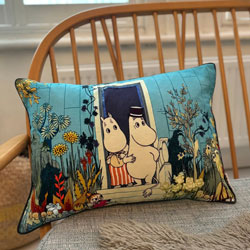 Moomin Riviera Cushion. A beautiful statement cushion cover featuring the iconic riviera design. Coming with navy and green tones, this beautiful print depicts Moomin mamma, Moomin pappa and Little My surrounded by lush green foliage. The flowers and gree