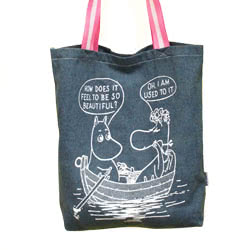 Moomin So Beautiful Denim Tote. This stylish blue denim tote bag features iconic character Moomin taking a boat trip with a lady troll. The quote shows Moomin asking: 'How does it feel to be so beautiful?' and her reply: 'Oh I am used to it
