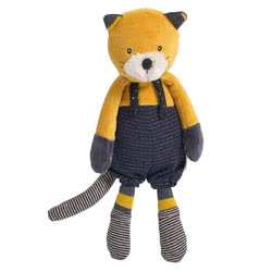 Moulin Roty Les Moustaches Lulu Cat. Featuring the large version of Lulu the Cat, coming with a golden yellow fur body, fluffy white muzzle, upright pointed ears, stripy socks and matching tail. Wearing dark blue dungarees and leggings.