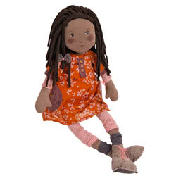 Moulin Roty Les Rosalies Camelia  Rag Doll. Coming with a soft padded body, dangly arms and legs and beautiful printed facial features,  tousled fabric dark brown hair with a front plait. She is wearing a removable orange flower print dress with plum pock