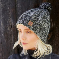 Pachamama Knitwear Cairngorm Bobble Beanie Charcoal features simple cable design, fluffy pompom and cream Sherpa Fleece lining