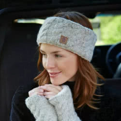 Pachamama Knitwear Cairngorm Headband Oatmeal featuring a simple cable knit design, mohair-wool blend, fleece lining.