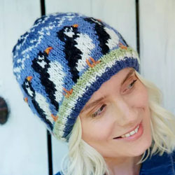 Pachamama Knitwear Circus of Puffins Beanie hats features hand-knitted puffin patterns, 100% wool, fleece lined.