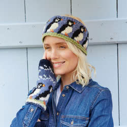 Pachamama Knitwear Circus of Puffins Headband ear warmers, featuring a row of puffins on a blue background, 100% wool, fleece lined.