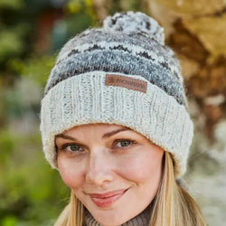 Pachamama Classic Fairisle Roll Back Bobble Beanie Natural Hat features a ribbed design with patterned bands, 100% Wool, fleece lined