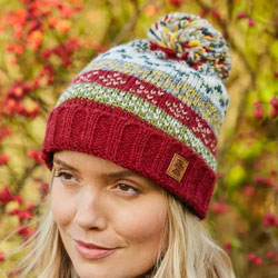 Pachamama Classic Fairisle Roll Back Bobble Beanie Rust rollback hat featuring patterned bands, 100% Wool, fleece lined.
