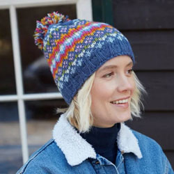 Pachamama Knitwear Clifden Denim Fine Knit Bobble Beanie hat featuring multicoloured diamond fair isle pattern, 100% wool, fleece lined