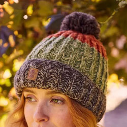 Pachamama Knitwear Cotopaxi Bobble Beanie Earth Hat features thick bands of earthy colours, 100% Wool, fleece lined