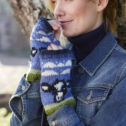 Pachamama Knitwear Dairy Cow Handwarmer fingerless gloves featuring Friesian cows, handknitted, 100% wool, fleece lined.