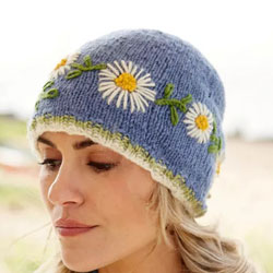Pachamama Knitwear Daisy Chain Beanie Jacaranda hat featuring a vintage style daisy chain flower pattern, 100% wool, fleece lined.
