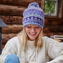 Pachamama Knitwear Finisterre Bobble Beanie Jacaranda hat featuring traditional Fair Isle patterns, 100% Wool, fleece lined.