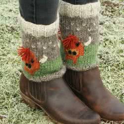 Pachamama Herd Of Highland Cow Boot Cuffs also called short leg warmers and boot toppers. Featuring the quirky highland cow design. These stylish  Pachamama Boot Cuffs are knitted in Nepal by local villagers using 100% wool and natural dyes to UK designs.