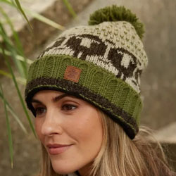 Pachamama Herdwick Sheep Roll Back Bobble Beanie Hat features black sheep on a green & oatmeal background, 100% Wool, fleece lined.