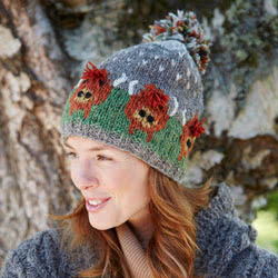 Pachamama Knitwear Highland Cow Bobble Beanie hat, handknitted, made from 100% wool 
with a fleece lining, coming with a hand embroided highland cow pattern.