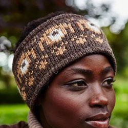 Pachamama Knitwear Sunflower Headband ear warmers, featuring a brown background with knitted pooch heads, hand knitted, 100% wool, fleece lined.
