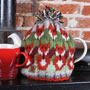 Pachamama Knitwear Skulk of Foxes Tea Cosy in-situ