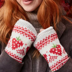 Pachamama Knitwear Strawberry Handwarmer fingerless gloves, handknitted, 100% wool, fleece lining, featuring hand stitched strawberry details over an oatmeal backgound.