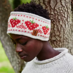 Pachamama Knitwear Strawberry Headband ear warmer, features a strawberry fair isle pattern in red and oatmeal, 100% Wool, fleece lined.