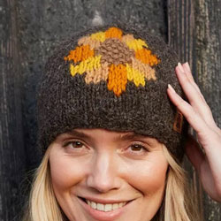 Pachamama Knitwear Sunflower Beanie hat features a sunflower design in orange, yellow & brown, hand-knitted, 100% wool, fleece lined.