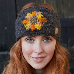 Pachamama Knitwear Sunflower Headband ear warmers, featuring an orange, yellow and brown sunflower, handknitted, 100% wool, fleece lined.