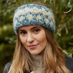 Pachamama Knitwear Totnes Headband Spruce ear warmers, featuring teal, creams and greens fair-isle pattern, hand-knitted, wool-mohair blend, fleece lined.