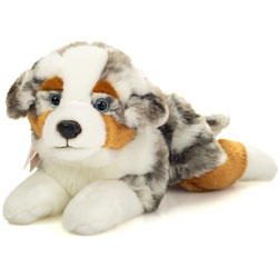 Teddy Hermann Australian Shepherd Dog Lying 40cm plush soft toy coming in a fluffy white, ginger and brown mottled fur coat with those characteristic drooped ears, blue eyes, short tail and black button nose.