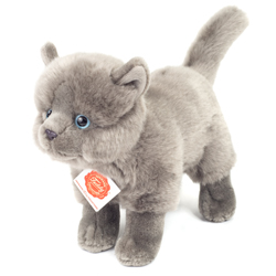 Teddy Hermann soft toy standing Carthusian Cat 20cm. Featuring mottled, fluffy grey fur body with upright ears, long tail, small button nose and piercing blue eyes.