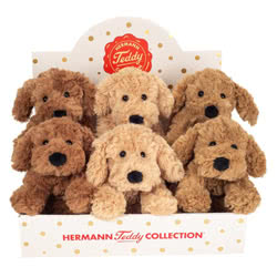 Teddy Hermann soft toys including the 20cm Lying Dogs coming in three colours; beige, brown and caramel.