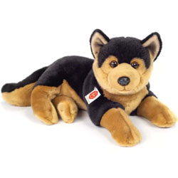 Teddy Hermann German Shepherd Dog soft toy lying. This 45cm Alsatian comes with soft brown & black fur, alert ears, cute button nose and long tail.