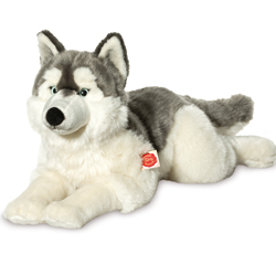 Teddy Hermann Husky Lying 60cm Plush Soft Toy coming in a white fur body with a dark-grey back which follows over to the piercing blue eyes.