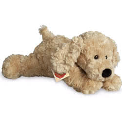 Teddy Hermann lying Beige Dog 28cm soft toy featuring a biscuit cream ruffled fur, floppy ears, short tail, cute black button nose and the most adorable looks.