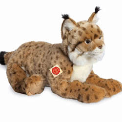 Teddy Hermann Lynx soft toy lying 45cm. Featuring hand stitched details, super soft speckled fur, pointed tufty ears, white fluffy cheeks and tummy.