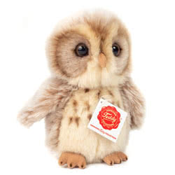 Teddy Hermann Owl  light brown soft toy in a 16 cm size. Coming in a mottled beige fur body with a speckled cream and brown chest, little  fawn coloured feet and beak and the classic owl eye sockets.