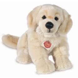 Teddy Hermann sitting Golden Retriever soft toy in a 30 cm size. Coming with a soft fluffy cream-coloured fur body. It features classic Retriever characteristics, including the soft brown button nose, floppy ears and thick tail.