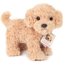 Teddy Hermann standing Cockapoo Dog soft toy in a 23 cm size. Coming in a light beige, ruffled fur body with. This adorable pup comes with the most adorable looks, a black button nose, cute floppy ears, with soft little paws.