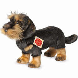 Teddy Hermann standing Wirehaired Dachshund soft toy 28cm. Featuring a smooth black fur coat, tan coloured short legs, smooth ears & the classic moustache, beard and characterful eyebrows.