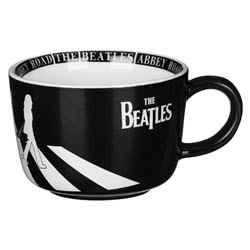 The Beatles Abbey Road Cup. This porcelain contemporary style cup features the iconic Abbey Road silhouette in white on sleek black glaze. Inside on the base of the cup is half a ceramic apple as a nod to Apple Records. It has Abbey Road text printed arou
