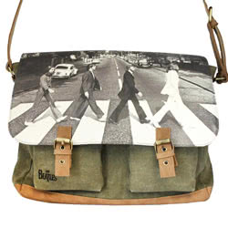 The Beatles Abbey Road Green Satchel. This satchel features the world famous Abbey Road album cover image on the front. It has an  adjustable strap, a faux buckle press magnetic fastening and a handy inner and back zip pockets. There are two front pouches
