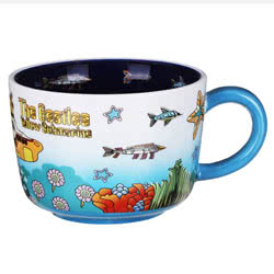The Beatles Yellow Submarine Cup. A contemporary style porcelain cup featuring archive imagery from the iconic psychedelic adventure - Yellow Submarine! The print features cartoon imagery of The Beatles, Chief Blue Meanie and of course, the Yellow Submari