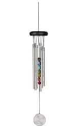 Woodstock Chakra Wind Chime with Seven 
Stones in silver..It comes with six silver tubes and has a black ash wood 
top. 
It is strung with UV-resistant nylon line and 
therefore perfect for in or outdoor placement..The windcatcher string has decorativ