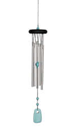 Woodstock Chakra Turquoise Wind Chime..This lovely musical wind chime represents sound and self-expression. Featuring a black finish ash wood, six silver polished aluminium solid rods, and beautiful turquoise stone accents and windcatcher.